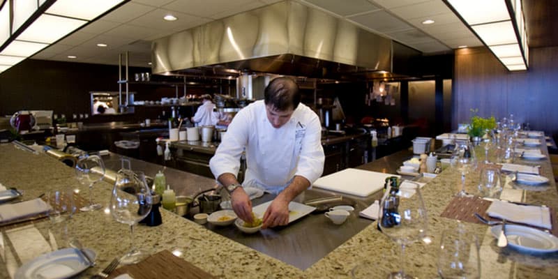 A Chef Preps Food In The JORY Restaurant