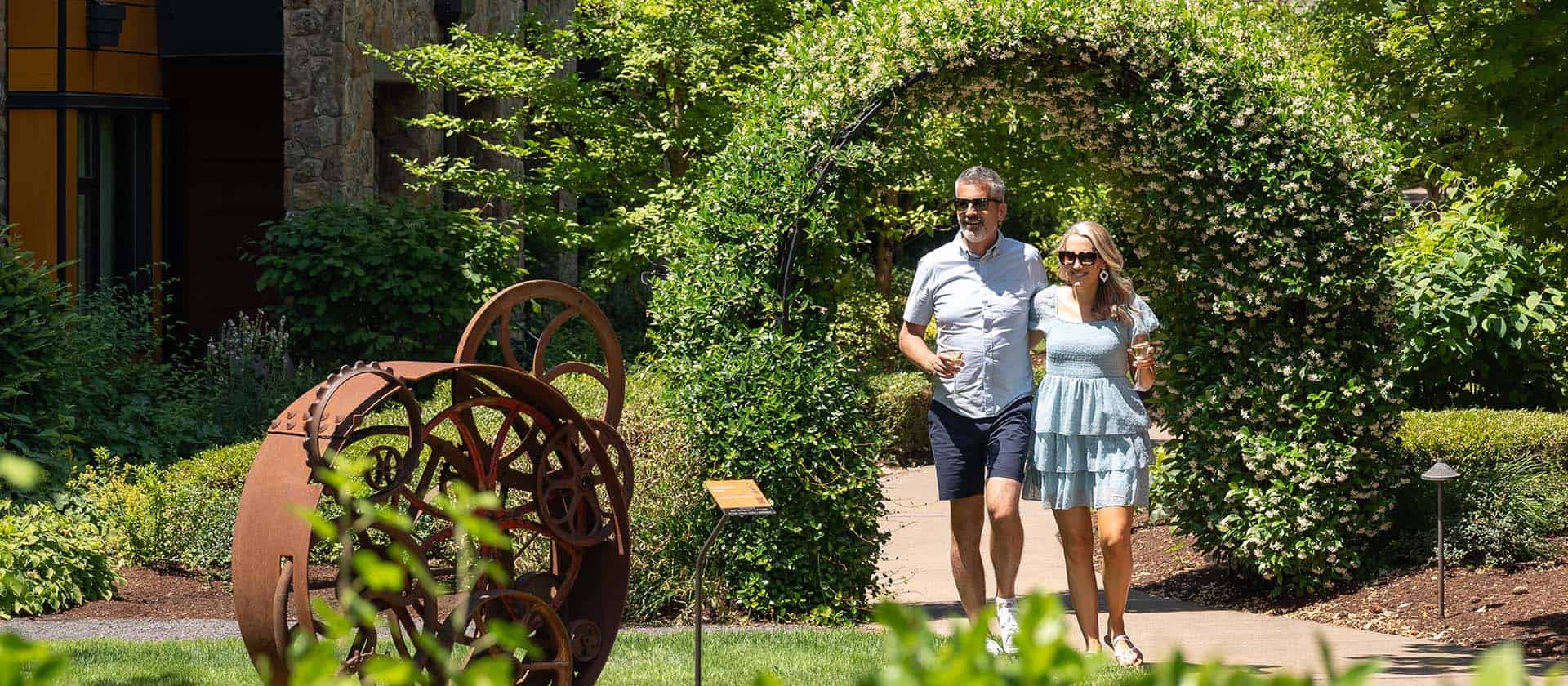 Guests Appreciating The Outdoor Art At The Allison Inn and Spa
