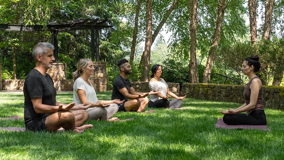 Outdoor Summer Yoga In The Meadow Garden At The Allison Inn and Spa