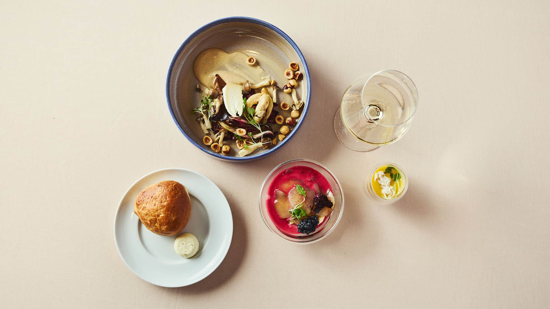 Ocean Experience and Warm Mushroom Salad with bread, amuse bouche and glass of white wine
