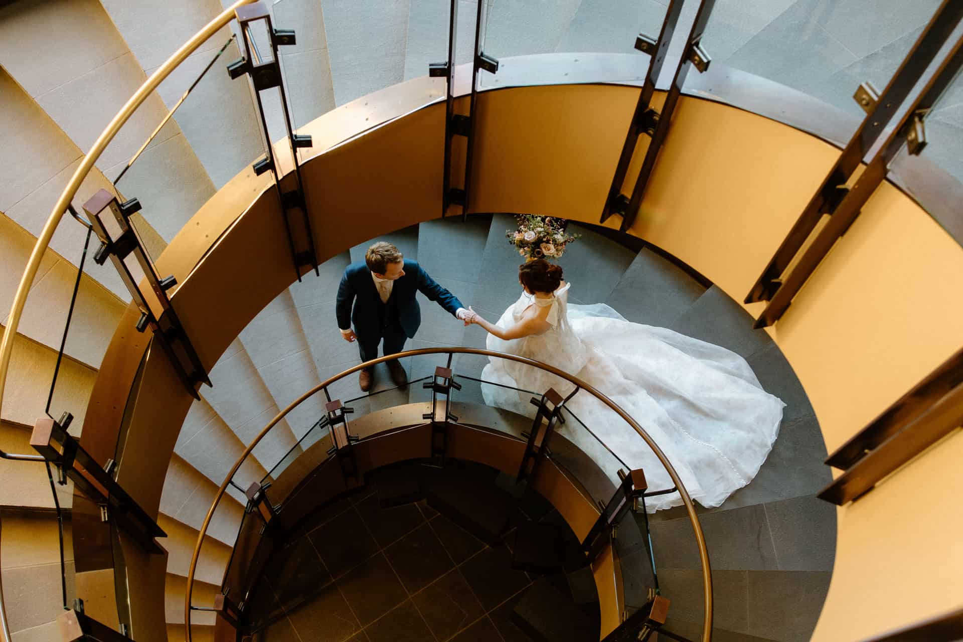 First look for a bride and groom on the spiral staircase.