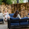 Four guests in robes on the spa terrace.