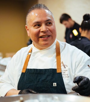 Chef Jack serving oysters during the 2025 reception.