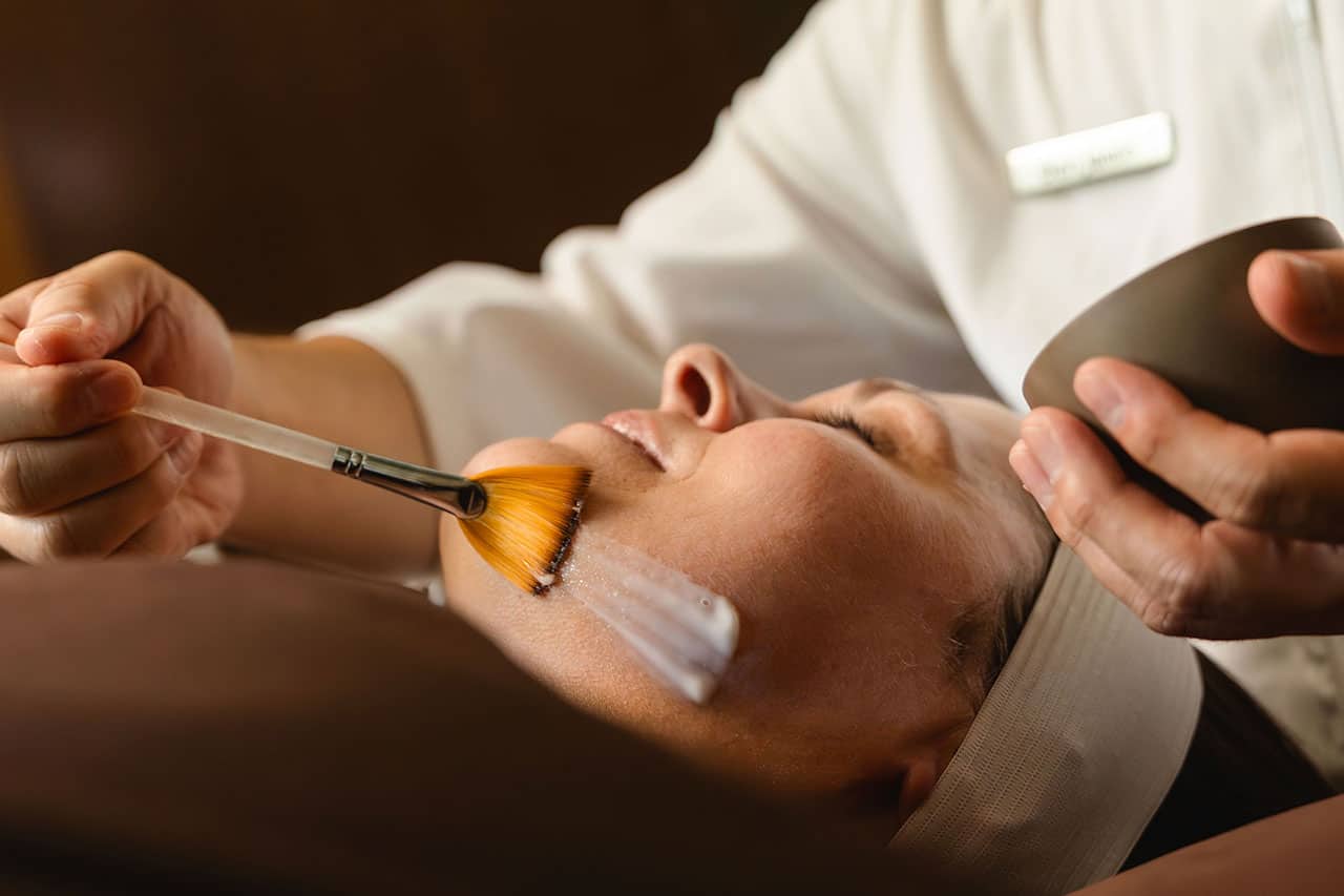 Female guest receiving a facial.