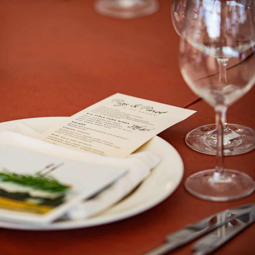 Dinner place setting with special menu and dried herbs from the garden.