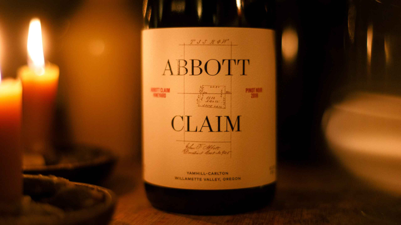 A close up of a bottle of wine from Abbott Claim.