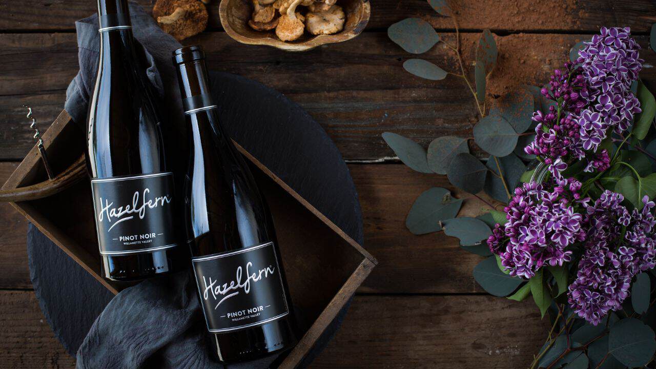 Two bottles of Hazelfern Cellars on display for Willamette Valley Wine Collective.