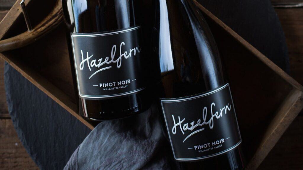 Bottles of Hazelfern Cellars' wine in a wood basket.
