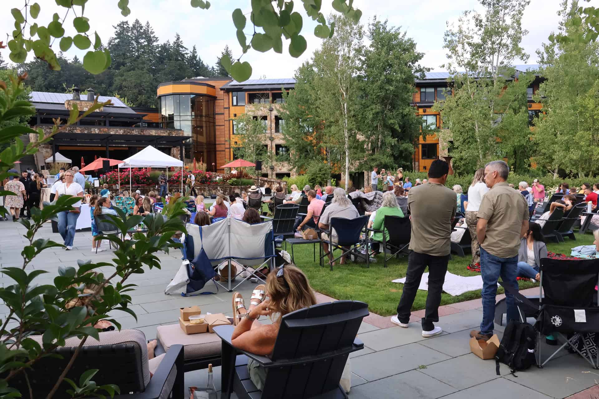 Guests gathered on the lawn of the Estate Garden listening to a local musician.
