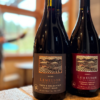 Three bottles of Lemelson Vineyard wine on a table.