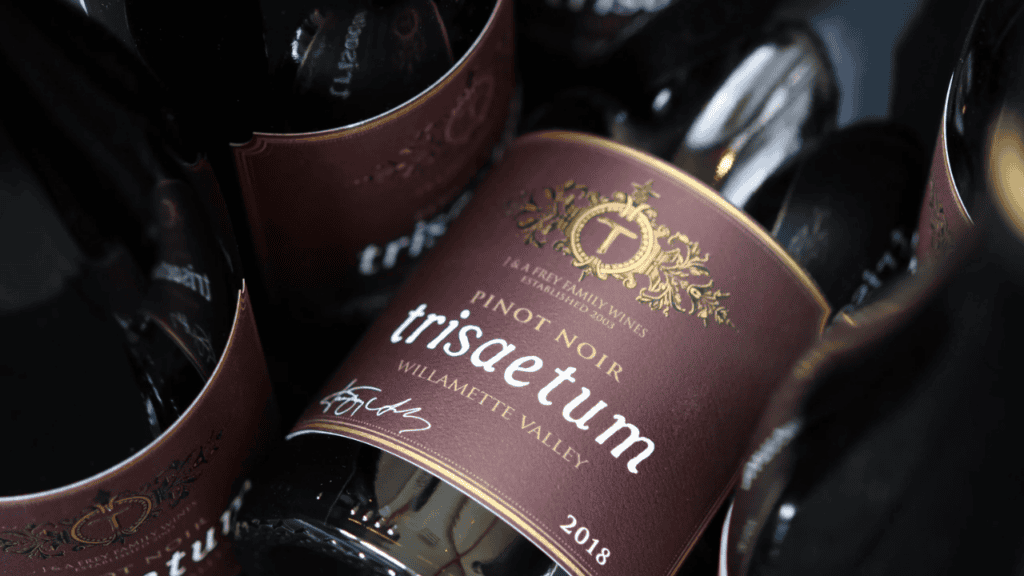 Multiple bottles of Trisaetum wine.
