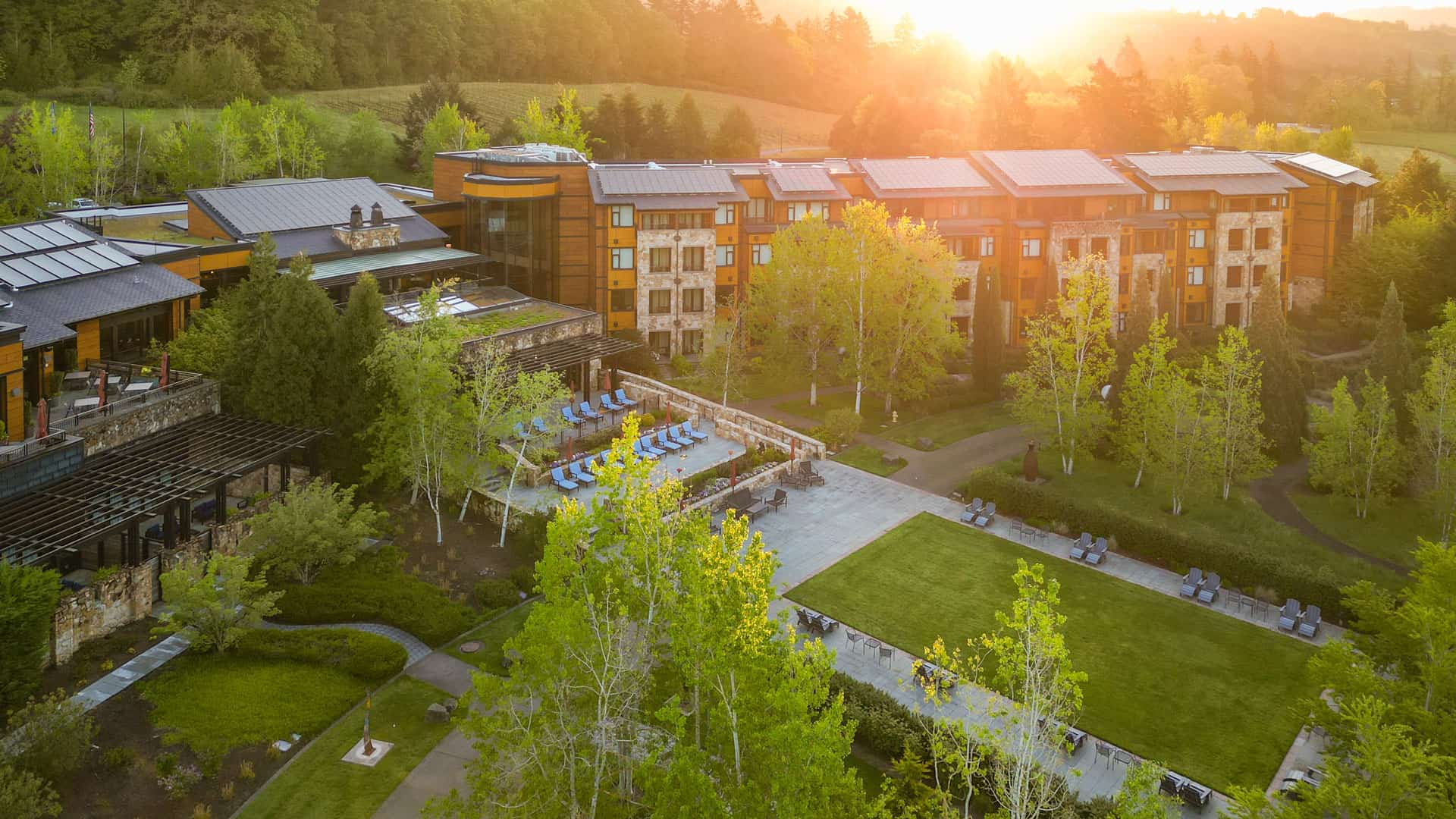 Aerial view of The Allison Inn & Spa from the Estate Garden at sunrise.