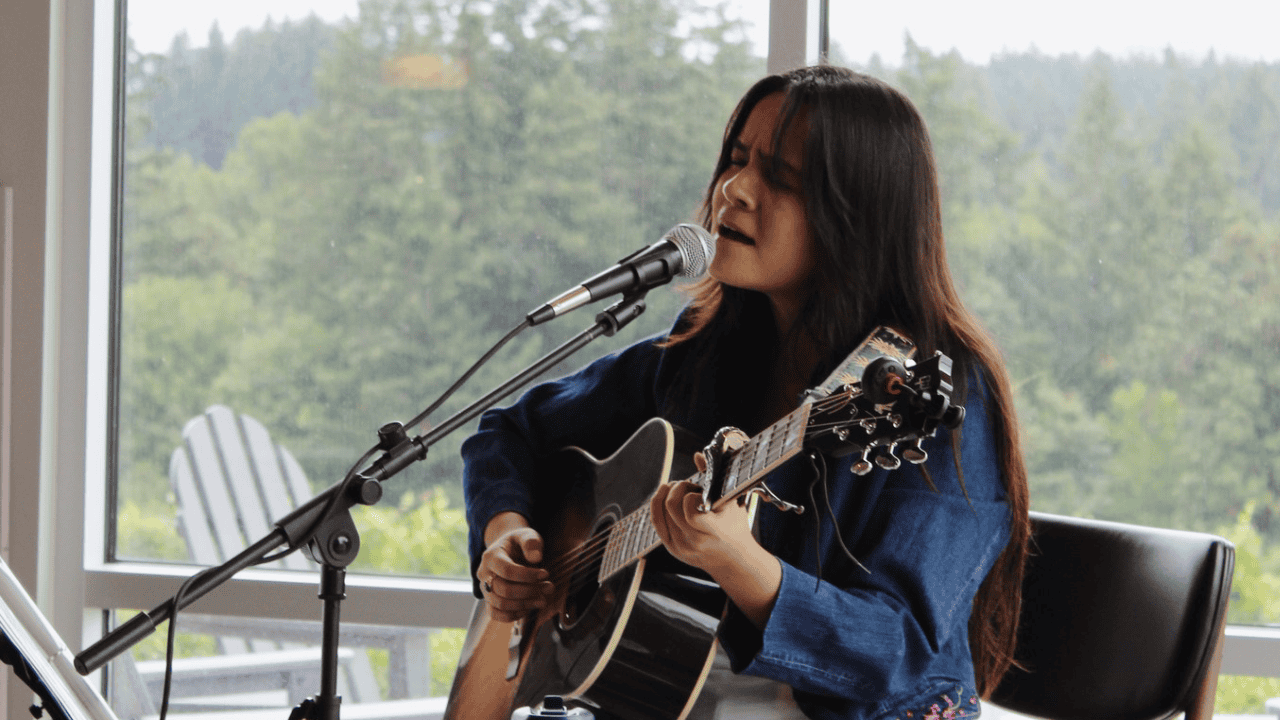 Mayra Sandoval, a musician from McMinnville, playing the guitar.