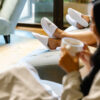 Three female guests in robes, lounging in the spa drinking tea.