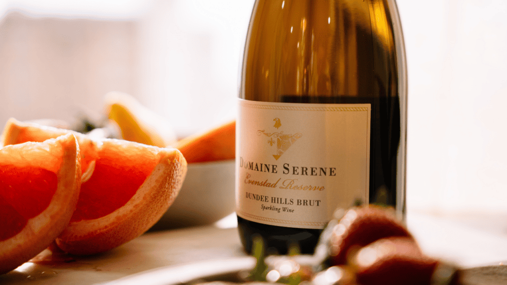 A close-up of Domaine Serene's wine with fruit.